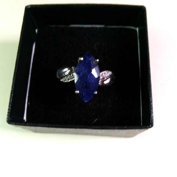 14k white gold over solid sterling silver diamonds and 2.5 CTW Sapphire. Natural